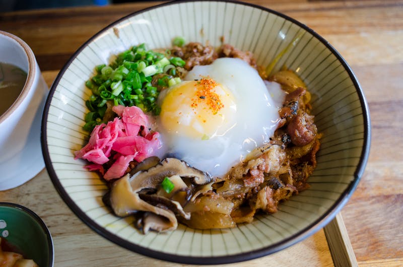 Carnitas Power Bowl with slow-braised pork and pickled onions